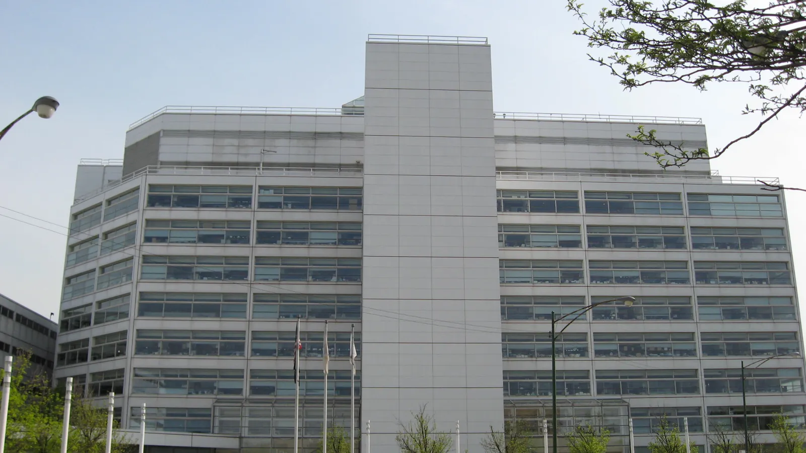 The multi-story white-paneled Cook County juvenile court and detention building in Chicago, with long bands of windows and flagpoles in front