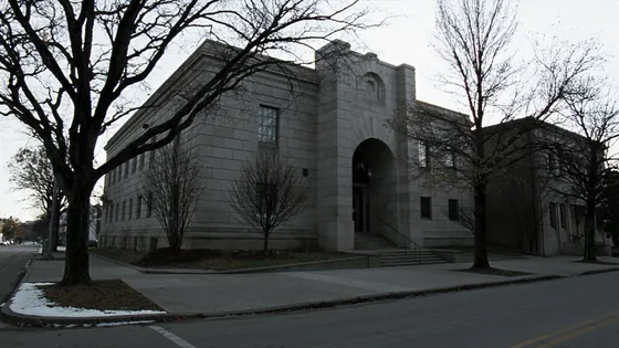 Burlington diocese bankruptcy dismissal: a granite courthouse on a bare autumn street