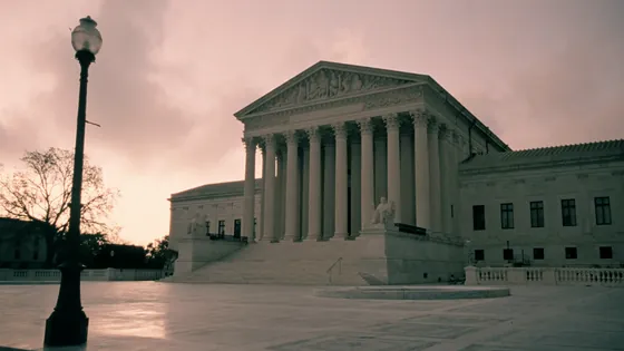 E. Jean Carroll v. Trump: a supreme court building at dawn